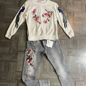 Cream sweater with grey pants